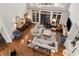Bright, expansive living room with hardwood floors, comfortable seating, and large windows, creating a welcoming atmosphere at 1485 Mill Place Dr, Dacula, GA 30019