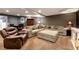 Finished basement living room with kitchenette, dining table and large sectional at 1485 Mill Place Dr, Dacula, GA 30019