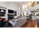 Spacious living room with high ceilings, fireplace, and kitchen access at 1485 Mill Place Dr, Dacula, GA 30019