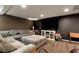 Finished basement living room features a large sectional and TV at 1485 Mill Place Dr, Dacula, GA 30019