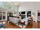 Open living room with fireplace, hardwood floors, and lots of natural light at 1485 Mill Place Dr, Dacula, GA 30019