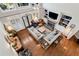 Spacious living room with fireplace, built-in shelving, high ceilings, and hardwood floors at 1485 Mill Place Dr, Dacula, GA 30019