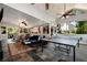 Large screened porch featuring slate floors, furniture, and ping pong table at 1485 Mill Place Dr, Dacula, GA 30019