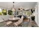Stylish screened porch features slate floors and an outdoor dining set with seating at 1485 Mill Place Dr, Dacula, GA 30019