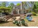 Tiered deck leading to a backyard fire pit area with ample seating for gatherings at 1660 Maple Ridge Dr, Loganville, GA 30052