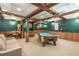 Finished basement featuring a pool table, wet bar, and recreation area at 1660 Maple Ridge Dr, Loganville, GA 30052