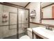 Bathroom featuring a glass shower enclosure, vanity, and updated fixtures at 1660 Maple Ridge Dr, Loganville, GA 30052
