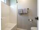 Bathroom with a white shower and tub combination and neutral gray walls at 1660 Maple Ridge Dr, Loganville, GA 30052