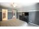 Bedroom featuring neutral carpet, two-tone paint, white trim, and a TV at 1660 Maple Ridge Dr, Loganville, GA 30052