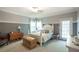 Charming bedroom with a ceiling fan, neutral carpet, and classic decor elements at 1660 Maple Ridge Dr, Loganville, GA 30052