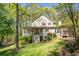 Charming two-story home with mature trees and landscaped front yard, including a covered porch at 1660 Maple Ridge Dr, Loganville, GA 30052