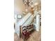Foyer featuring hardwood floors, a staircase with white railings, and decorative wall art at 1660 Maple Ridge Dr, Loganville, GA 30052