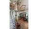 Spacious foyer with hardwood floors, high ceilings with ornate chandelier, and an adjacent dining room at 1660 Maple Ridge Dr, Loganville, GA 30052