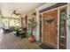 Inviting front porch features comfortable seating and charming decor, perfect for relaxation at 1660 Maple Ridge Dr, Loganville, GA 30052