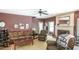 Living room with hardwood floors, fireplace, and staircase leading to the upper level at 1660 Maple Ridge Dr, Loganville, GA 30052