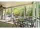 Outdoor seating area with a table and chairs, surrounded by lush greenery at 1660 Maple Ridge Dr, Loganville, GA 30052