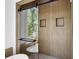 Contemporary shower with a sleek glass enclosure, modern fixtures, and wood-look tile at 1882 Francis Nw Ave, Atlanta, GA 30318