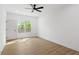 Bright bedroom featuring hardwood floors, a ceiling fan and natural light from the window at 1882 Francis Nw Ave, Atlanta, GA 30318
