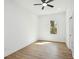 Bright bedroom featuring hardwood floors, a ceiling fan and a window with natural light at 1882 Francis Nw Ave, Atlanta, GA 30318