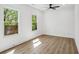Bright bedroom featuring hardwood floors, a ceiling fan and natural light from two windows at 1882 Francis Nw Ave, Atlanta, GA 30318