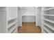 Walk in Closet with custom shelving and hardwood floors at 1882 Francis Nw Ave, Atlanta, GA 30318