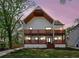Stunning two-story home featuring a modern design, wooden balconies, and a meticulously manicured lawn at 1882 Francis Nw Ave, Atlanta, GA 30318