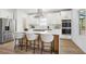 Modern kitchen featuring stainless steel appliances, quartz countertops, and bar stool seating at 1882 Francis Nw Ave, Atlanta, GA 30318