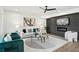Stylish living room boasts modern accents, a sleek ceiling fan, and eye-catching artwork at 1882 Francis Nw Ave, Atlanta, GA 30318