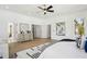 Spacious main bedroom with hardwood floors, ceiling fan, and a ensuite bathroom and walk in closet at 1882 Francis Nw Ave, Atlanta, GA 30318