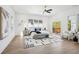 Bright bedroom with a ceiling fan, and a sliding glass door leading to a balcony at 1882 Francis Nw Ave, Atlanta, GA 30318