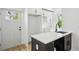 Wet Bar featuring black cabinetry, quartz countertops, with access to the exterior at 1882 Francis Nw Ave, Atlanta, GA 30318