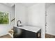 Wet Bar featuring black cabinetry, quartz countertops, with access to the exterior at 1882 Francis Nw Ave, Atlanta, GA 30318