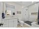 Elegant bathroom featuring textured white tile in shower and modern finishes at 284 Hook St, Alpharetta, GA 30009