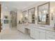 Bright bathroom featuring double vanity, stand alone shower, and multiple mirrors at 284 Hook St, Alpharetta, GA 30009