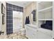 Stylish bathroom with a walk-in shower, custom vanity, and decorative floor tiles at 284 Hook St, Alpharetta, GA 30009