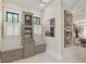 Bright bathroom featuring storage cabinets, small seats with drawers and multiple windows at 284 Hook St, Alpharetta, GA 30009