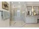 Bright bathroom with large glass shower and double vanity with decorative mirrors at 284 Hook St, Alpharetta, GA 30009
