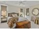 Calming bedroom with a trunk at the foot of the bed, a ceiling fan, and neutral tones at 284 Hook St, Alpharetta, GA 30009