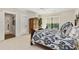Spacious bedroom featuring a decorative bed frame, ample natural light, and an ensuite bath at 284 Hook St, Alpharetta, GA 30009