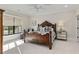 Elegant bedroom with a decorative wood bed frame, dresser, and window at 284 Hook St, Alpharetta, GA 30009
