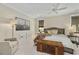 Calming bedroom with a trunk at the foot of the bed and a modern art piece at 284 Hook St, Alpharetta, GA 30009