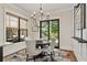 Cozy dining area with stylish chandelier and access to outdoor patio at 284 Hook St, Alpharetta, GA 30009