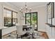 Bright dining area featuring a stylish chandelier, elegant decor, and seamless transition to the outdoor space at 284 Hook St, Alpharetta, GA 30009