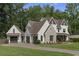 Attractive home with a spacious three-car garage, complementing the home's architectural style at 284 Hook St, Alpharetta, GA 30009