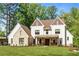 Striking exterior showcasing a two-story home with a manicured lawn, and brick-and-siding design at 284 Hook St, Alpharetta, GA 30009