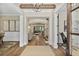 Elegant foyer with hardwood floors, a decorative rug, and an open view into other living spaces at 284 Hook St, Alpharetta, GA 30009