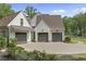 Spacious three-car garage with a paved driveway, enhancing the curb appeal of this lovely home at 284 Hook St, Alpharetta, GA 30009