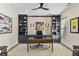 Stylish home office with custom shelving, decorative art, and comfortable desk setup at 284 Hook St, Alpharetta, GA 30009