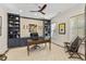 Elegant home office features custom built-ins, ceiling fan, and neutral color palette at 284 Hook St, Alpharetta, GA 30009
