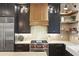 Modern kitchen features stainless steel appliances, a gas range, and custom cabinetry at 284 Hook St, Alpharetta, GA 30009